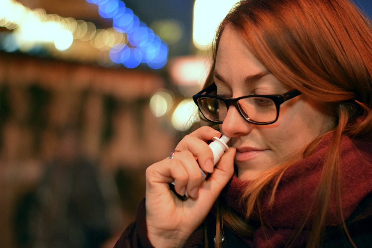 Woman using Spravato&reg;, an FDA-approved nasal spray made from esketamine, a purified form of ketamine.